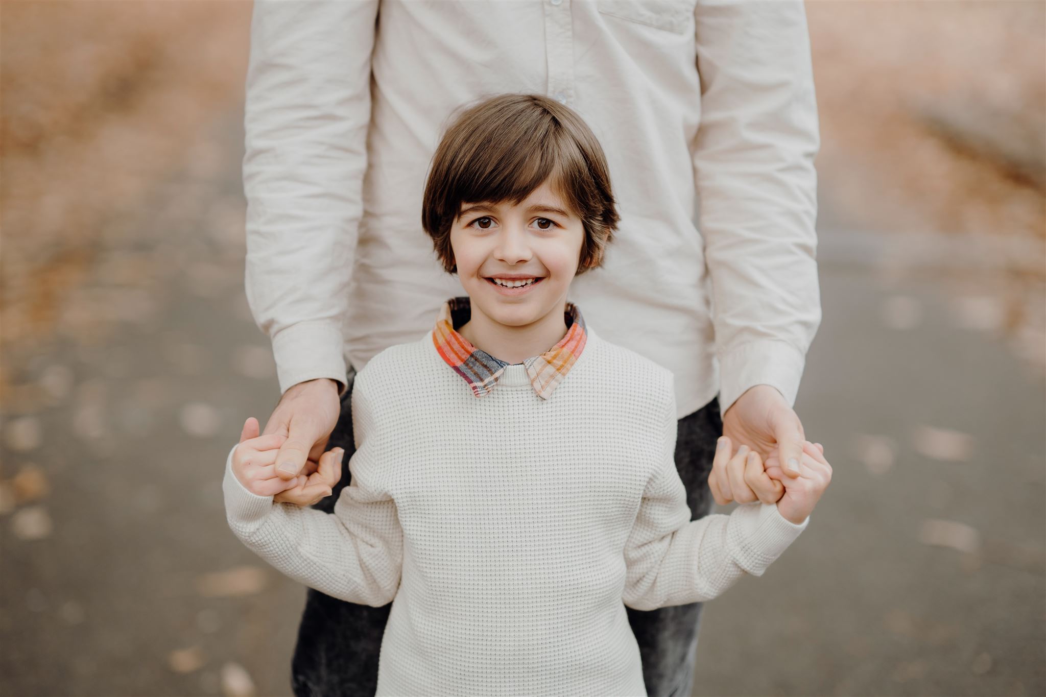 A photograph of a boy and his father during an Autumn Family Photoshoot in Morrinsville taken by Waikato Family Photographer Haley Adele